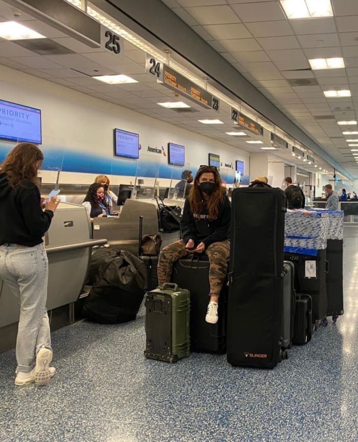 Janine Berey and Cindi Blair in an airport traveling for SI Swimsuit.